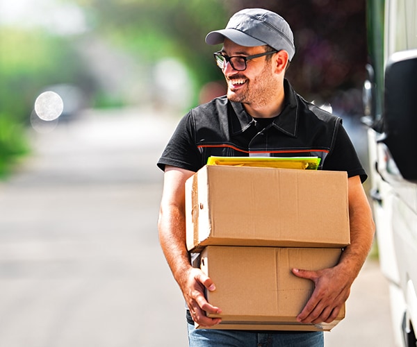 Smiling postal service employee